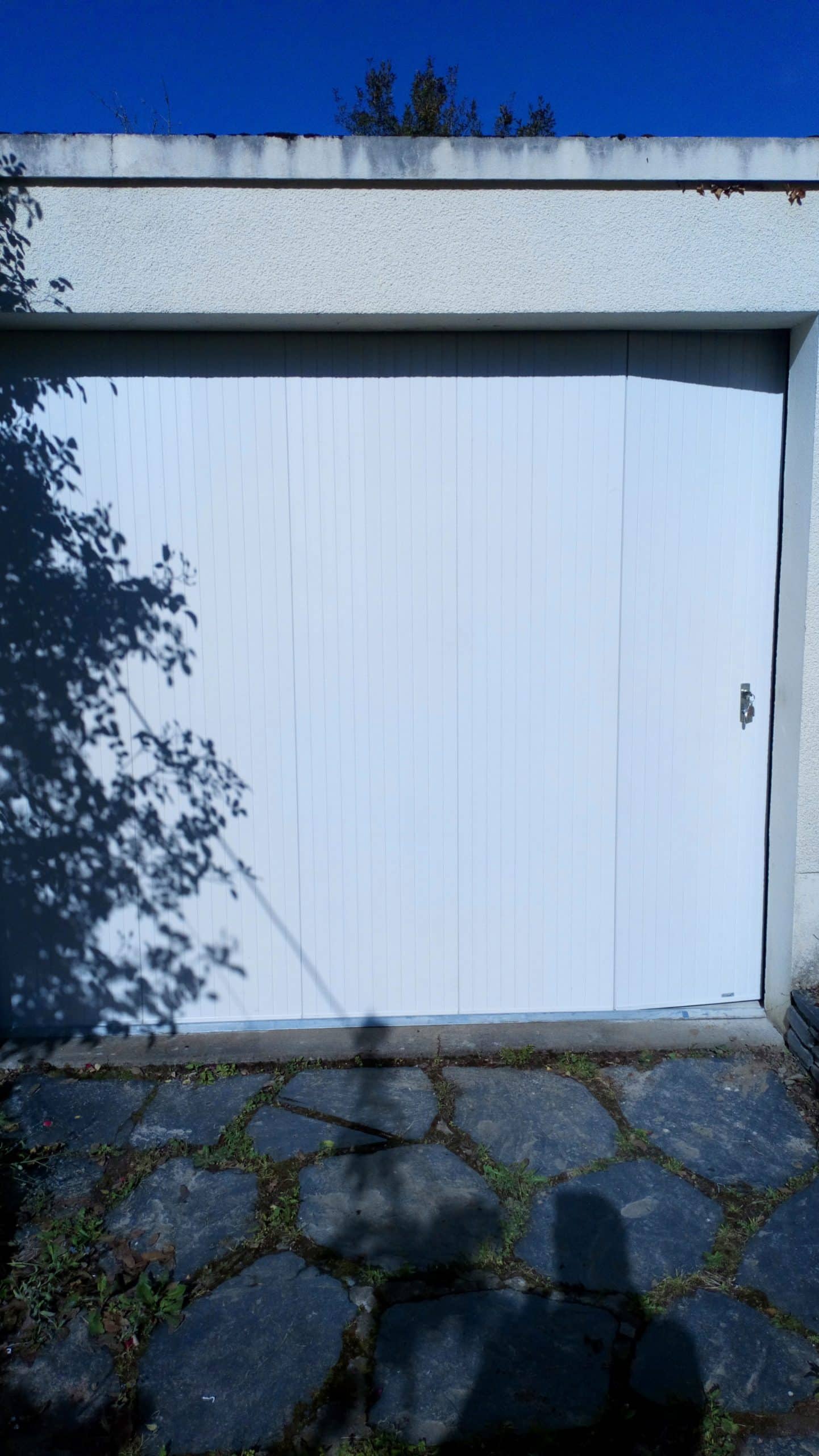 Porte de garage coulissante pvc